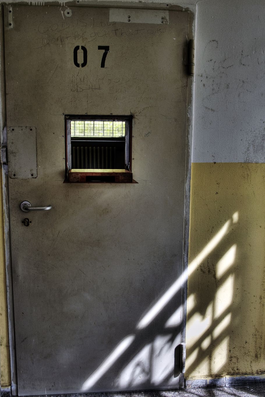 prison, cell, prison cell, prison wing, iron door, architecture, built structure, wall - building feature, building exterior, shadow