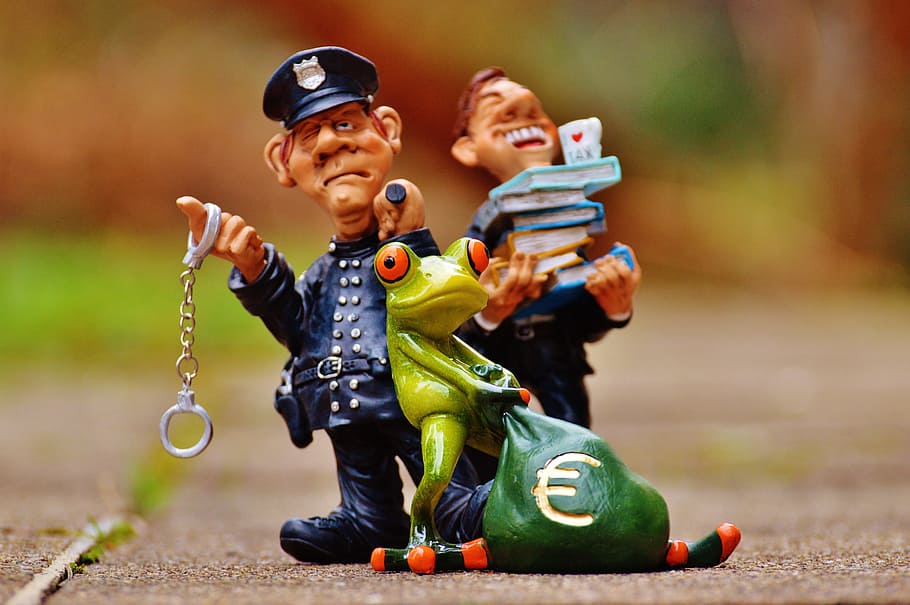 police office, red, eyed, tree frog figurines, taxes, tax evasion, police, handcuffs, scam, tax consultant