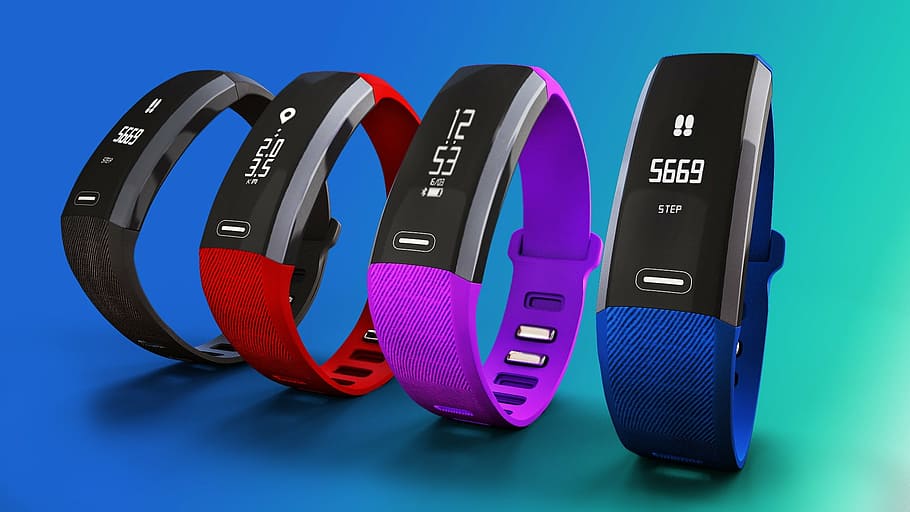 four fitness bands, heart rate monitoring device, bp monitoring device, health monitoring device, fitness band, pearls band, health tracker, blue, colored background, telephone