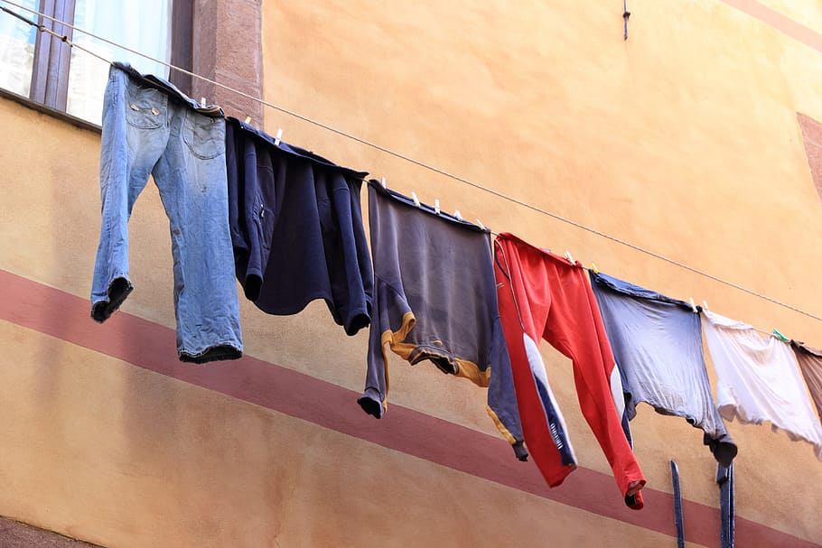 Italy, Sardinia, Bosa, Washing, Laundry, drying, hanging, clothing, multi colored, in a row