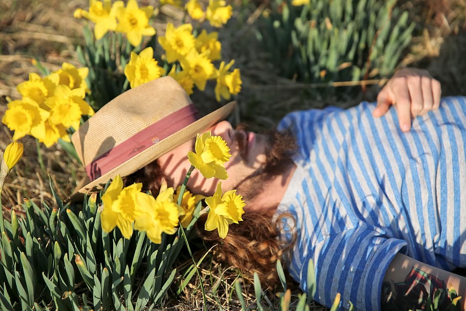 man, wearing, hat, lying, amongst flowers, lying down, flowers, people, field, flower