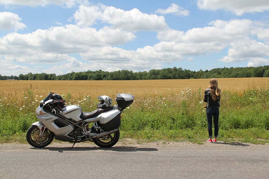 woman, standing, motorcycle, farm, ducati, girl, sport touring, rural, journey, motorbike