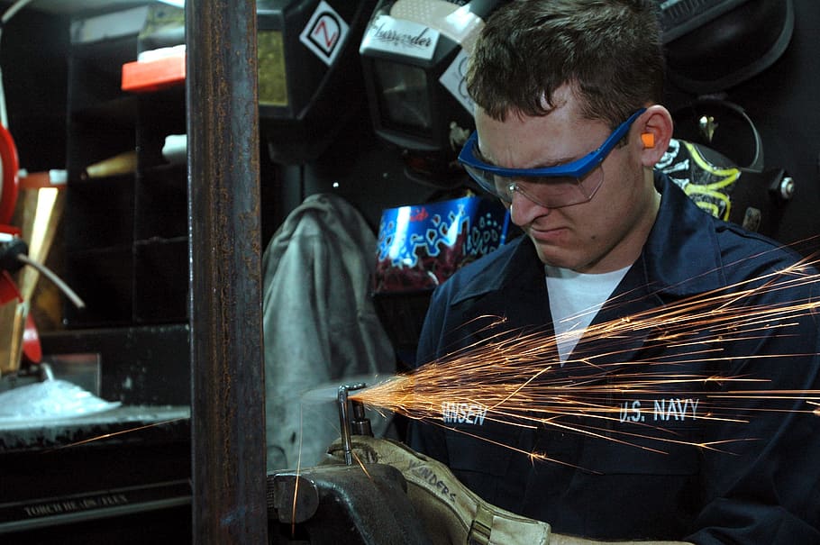 man welding, grinding, maintenance, labor, work, worker, machine, job, sparks, mask
