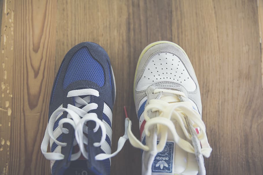 two, unpaired, blue, white, adidas, running, shoes, brown, wooden, floor