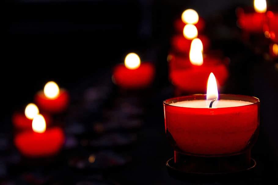 tilt-shift lens photography, lit-up candle glass, candle, mourning, church, religion, candlelight, light, commemorate, faith