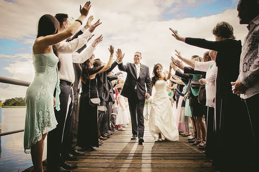 groom, walking, isle, giving, high-five, white, cloudy, skies, daytime, Bride