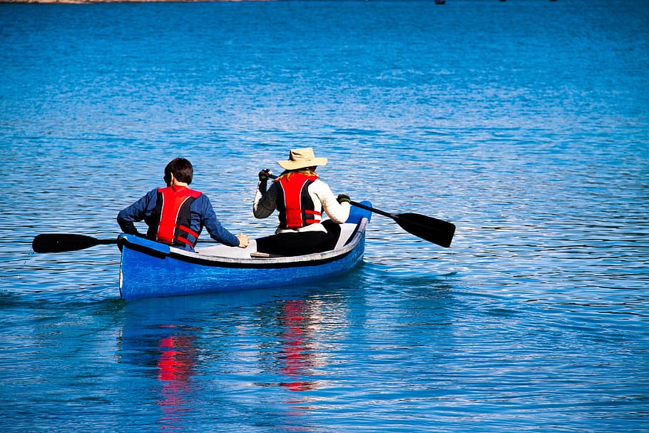 two, people, riding, boat, blue, calm, body, water, daytime, moraine lake