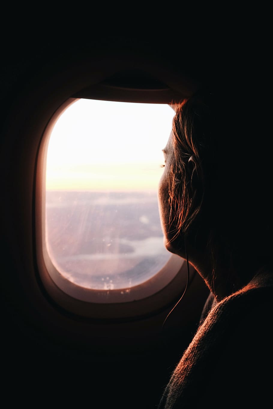 woman, looking, airplane window photo, daytime, blur, cord, light, outdoors, person, side view