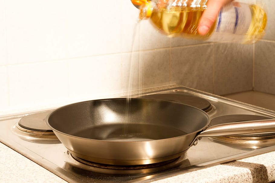 person, pouring, oil, frying, pan, kitchen, heat, sear, cook, frying pan