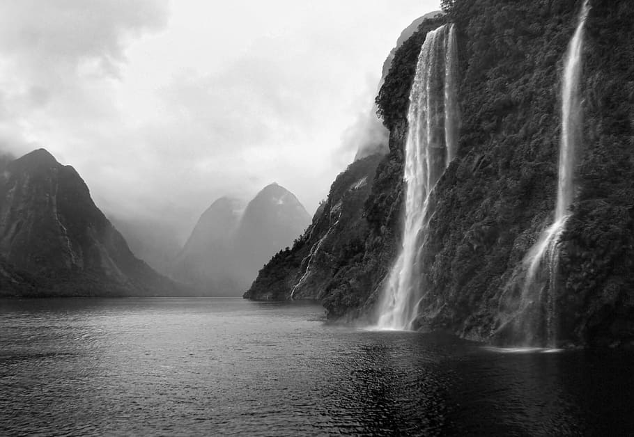 Doubtful Sound, New Zealand, grayscale photo of waterfalls, water, scenics - nature, beauty in nature, waterfront, mountain, waterfall, motion