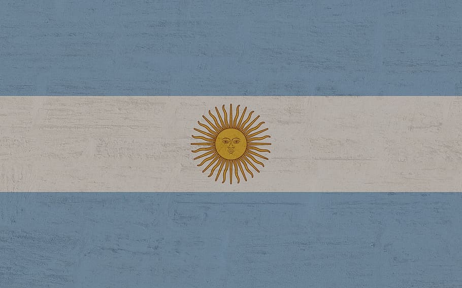celestial sun flag, argentina, flag, indoors, wood - material, directly above, close-up, wall - building feature, freshness, table