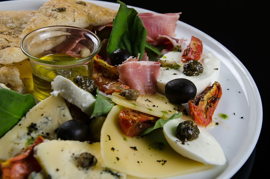 slices of meat, foccacia with olives, tasting, gourmet food, black olives, olive oil, dish, rosemary, tomato sauce, spices