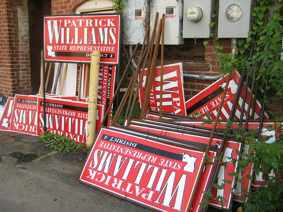 campaign, election, signs, political, communication, text, sign, western script, red, architecture