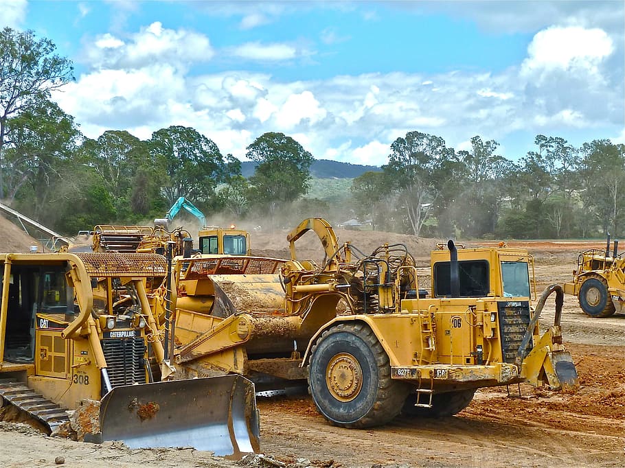yellow, gray, front loader, bulldozer, crawler, earth-moving, earthwork operations, land clearing, infrastructure development, civil