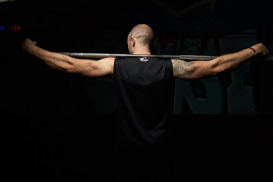 man, wearing, black, sleeveless, top, holding, gray, barbell rod, sport, bodybuilding