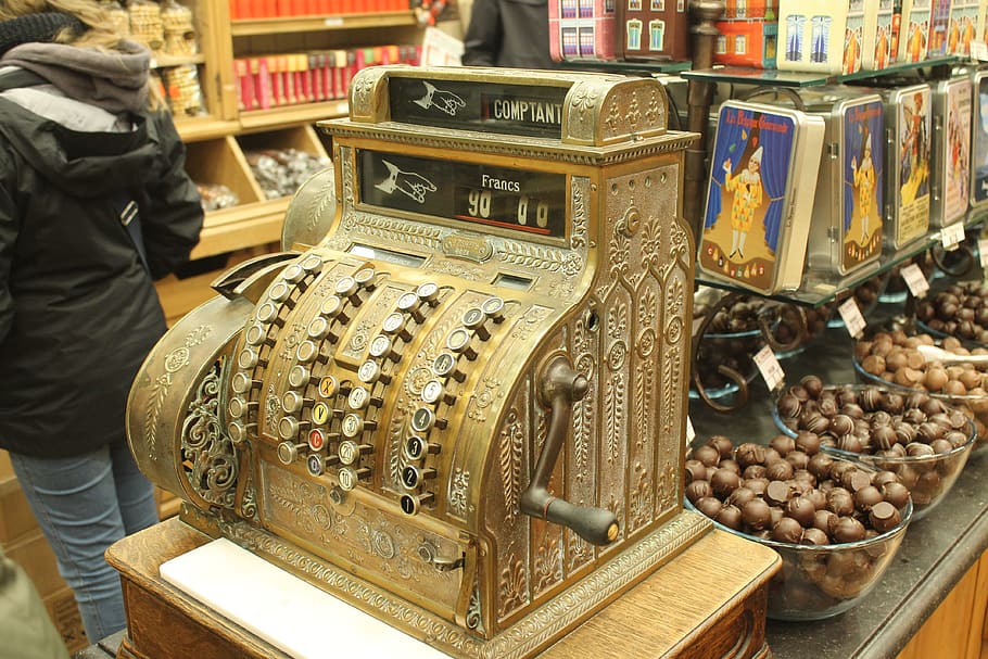 belgium, brussels, cash register, tourism, book, publication, indoors, still life, large group of objects, retail
