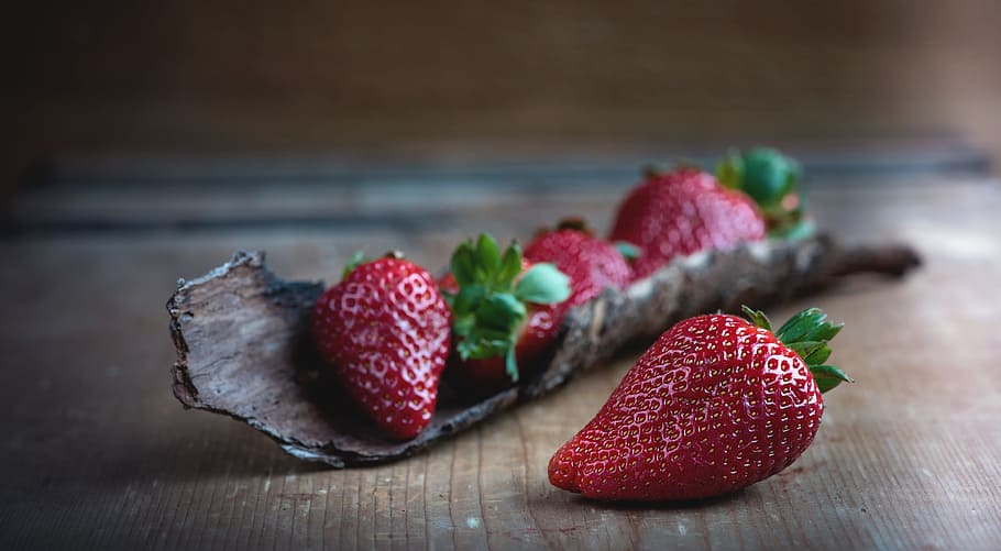 person, taking, strawberry, tilt shift photography, strawberries, red, ripe, of course, natural product, wood