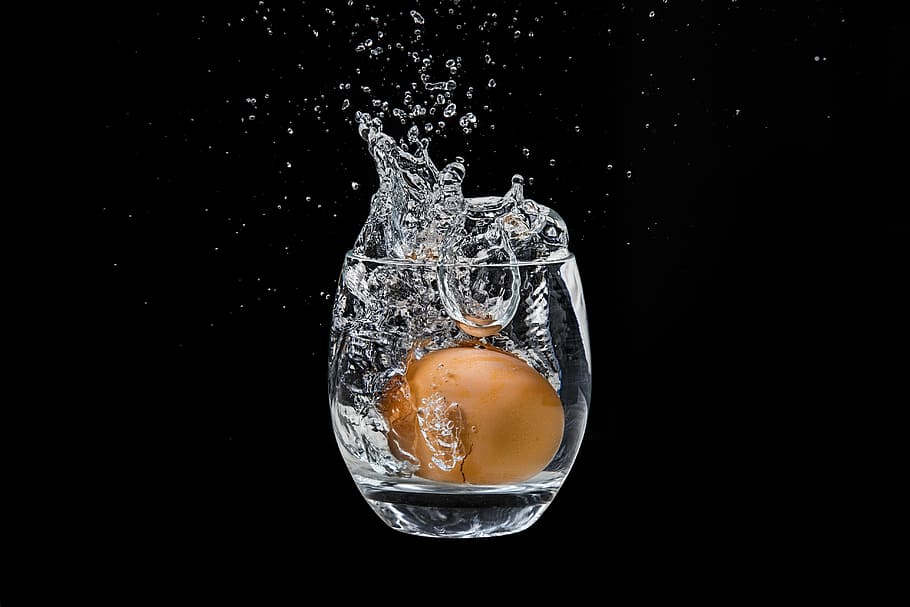 the egg in the glass, water, splash, drop, drops, spray, transparent, cracked, bubbles, throw