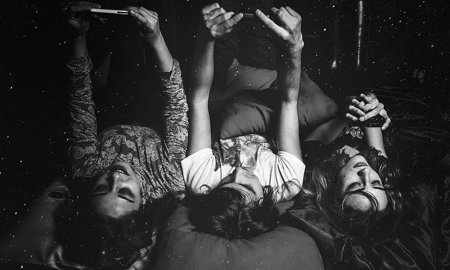 grayscale photo, group, women, friends, phone, bed, bite, a vampire, couple, spooky
