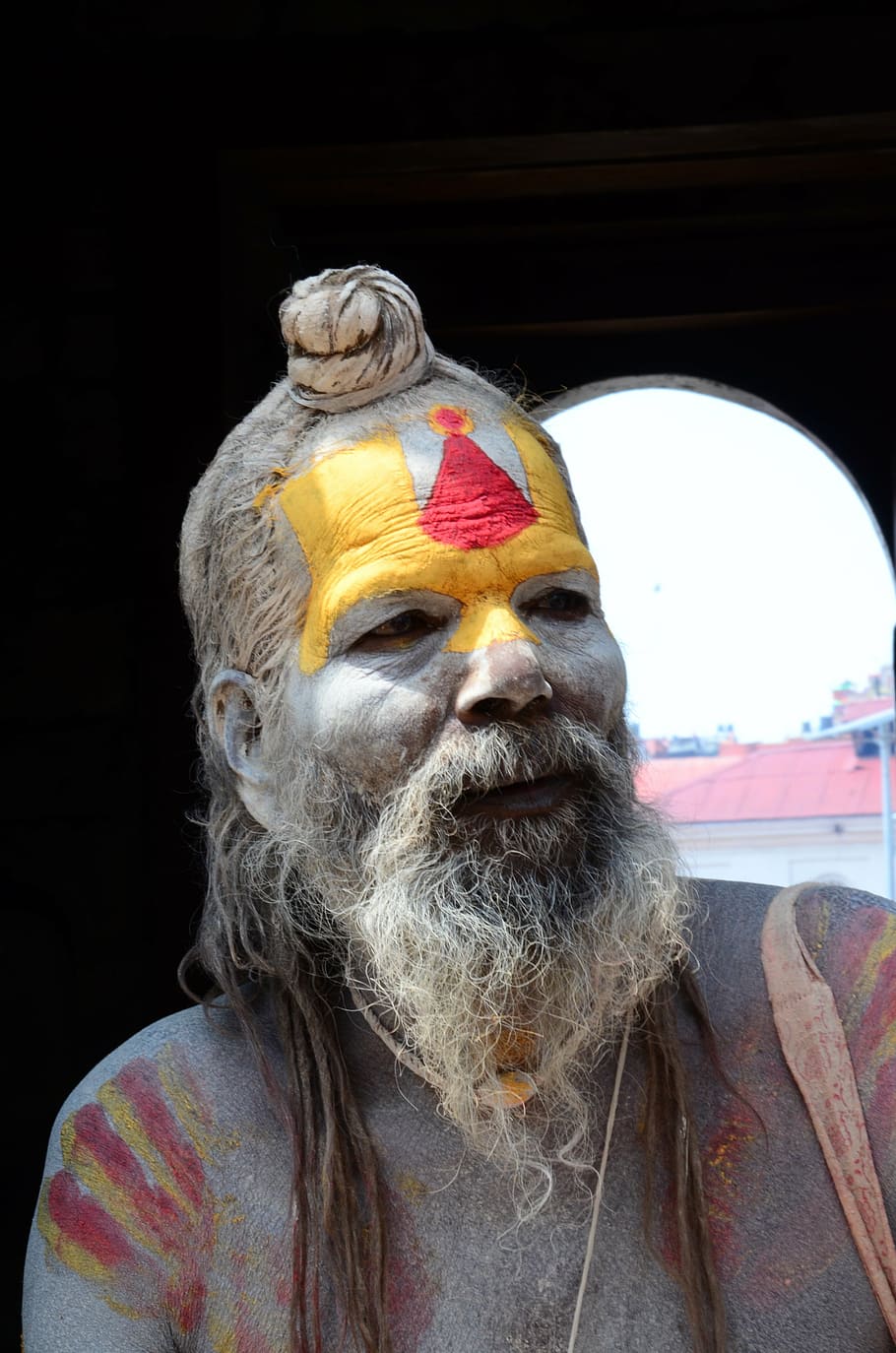 man, yellow, red, painted, face portrait photo, nepal, holy, old man, sadhu, beard