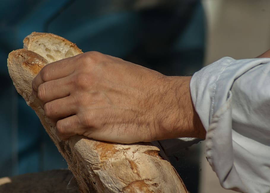 bread, stick, sandwich, boulanger, human hand, hand, food, food and drink, one person, holding
