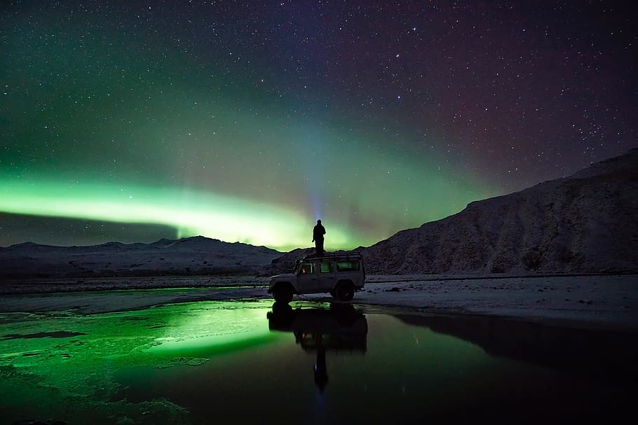 person, standing, top, suv, front, mountain, nighttime, green, aurora borealis, people