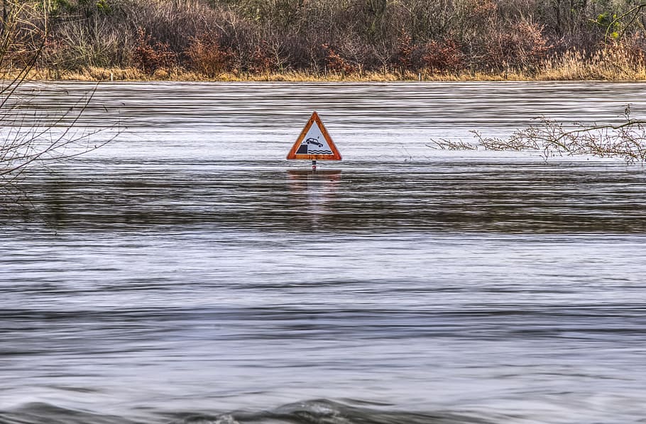 red, white, river signage, high water, flow, river, flooding, flooded, risk, attention