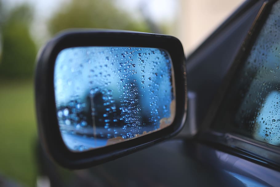  selective  focus photography vehicle side mirror  water 