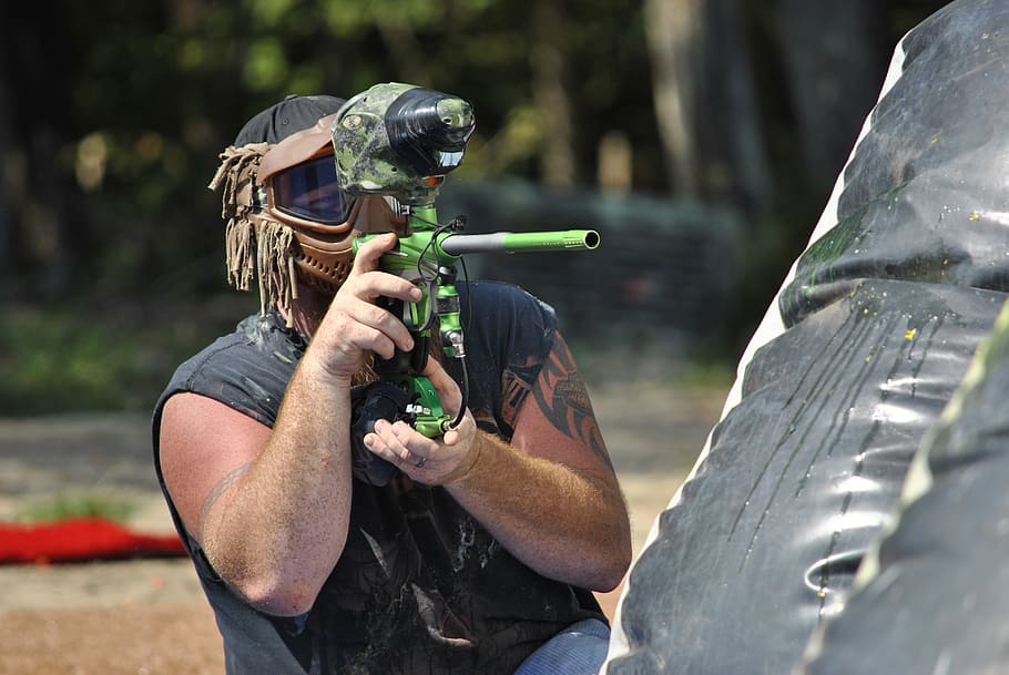 paintball, sports, extreme, day, holding, one person, gun, nature, weapon, plant