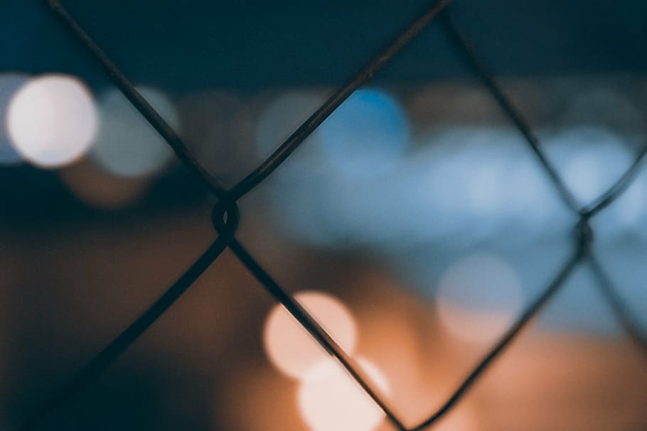close-up photography, gray, metal barb wire, wire, bokeh, dark, night, lights, chainlink fence, protection