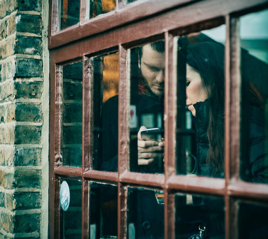 man, woman, standing, window, glass, couple, mobile, love, texting, phone