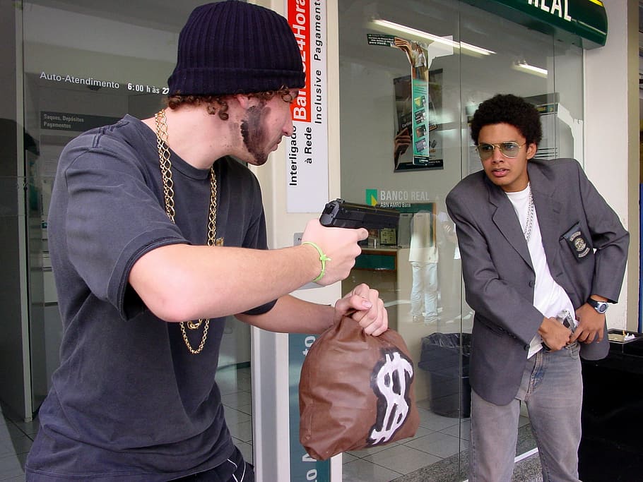 man, holding, money bag, gun, pointing, wearing, black, blazer, robber, money