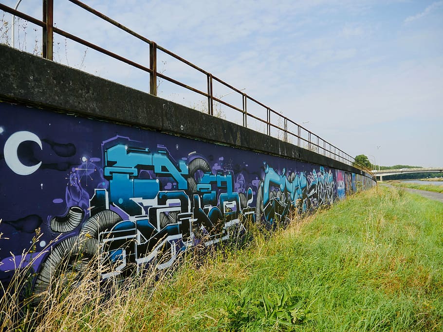 tags, street art, mons, bridge, built structure, architecture, graffiti, sky, grass, plant
