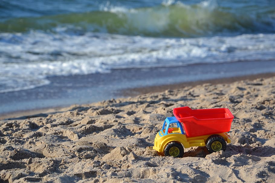 red, yellow, dump, truck toy, seashore, toy car, car, toy, toys, sea