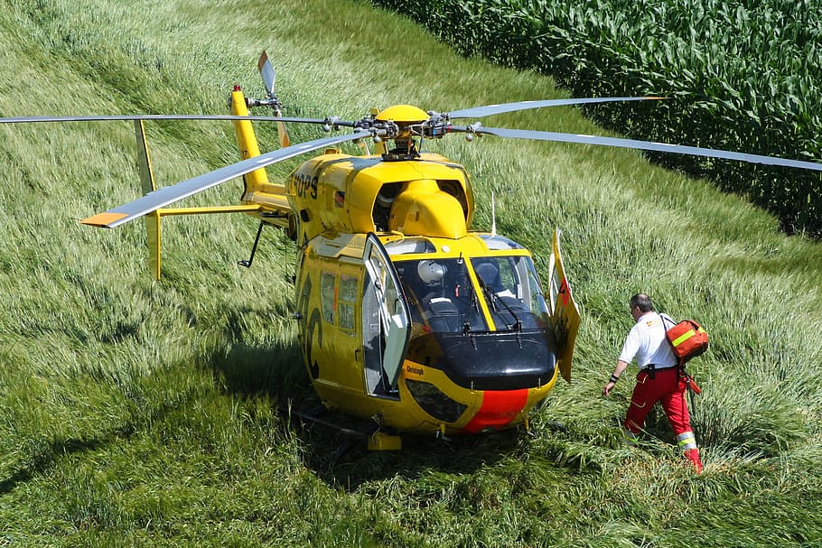 man, walking, yellow, red, helicopter, daytime, rescue helicopter, fly, adac, air rescue