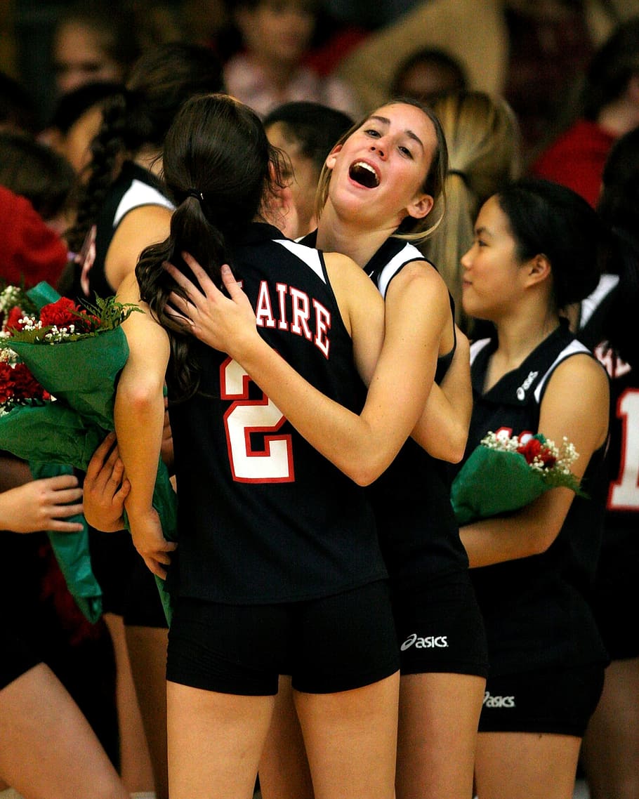 two woman hugging, volleyball team, celebration, victory, winners, roses, team, volleyball, sport, celebrating