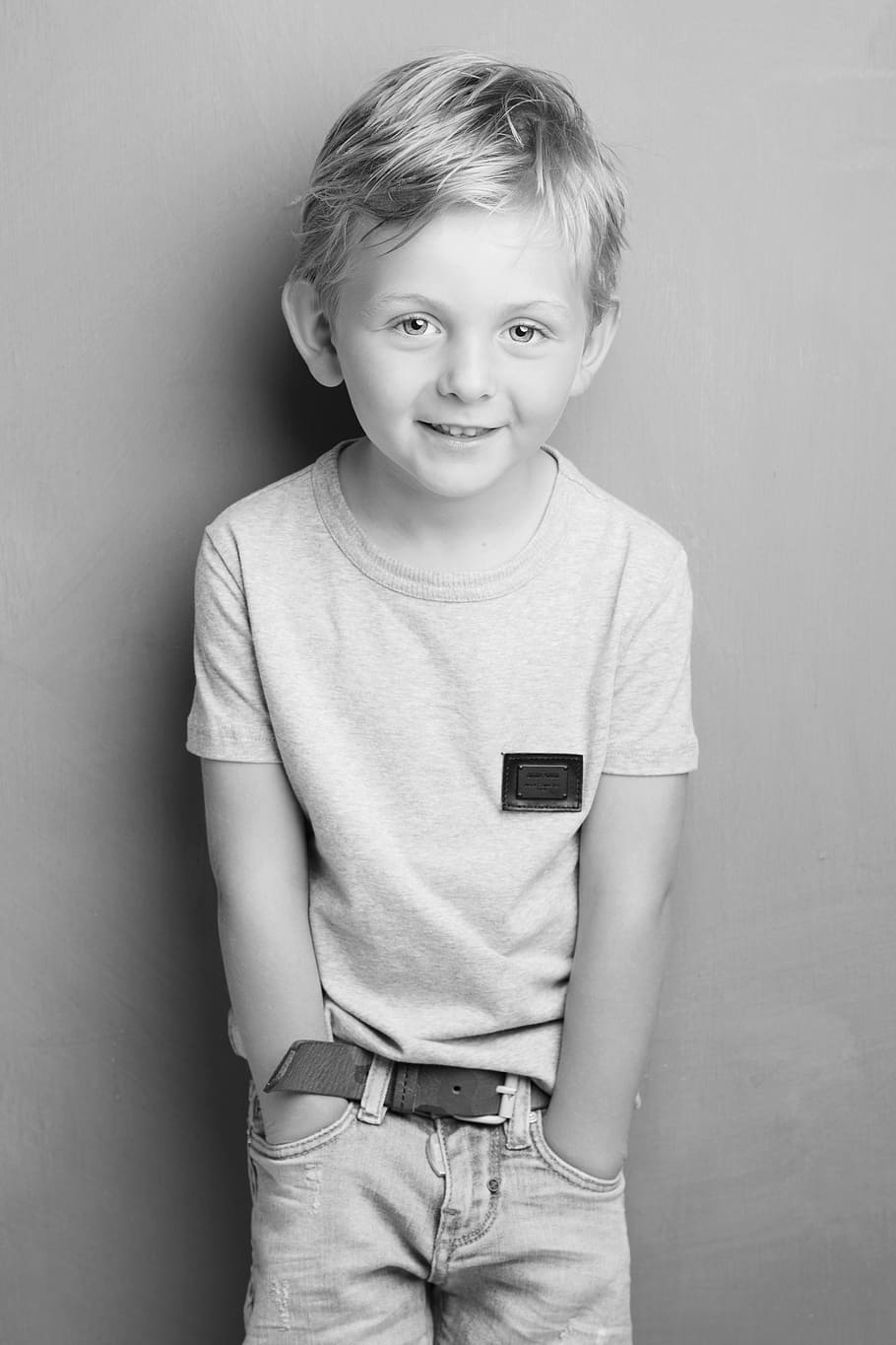 portrait photo, boy, child, glance, portrait, looking at camera, front view, smiling, casual clothing, one person