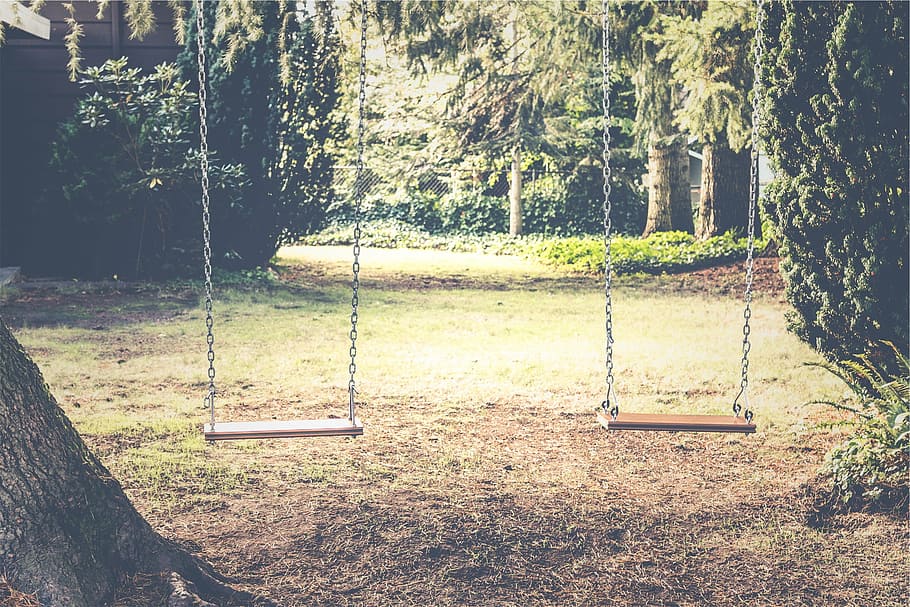 two outdoor swings, empty, two, brown, wooden, swings, backyard, trees, grass, playground