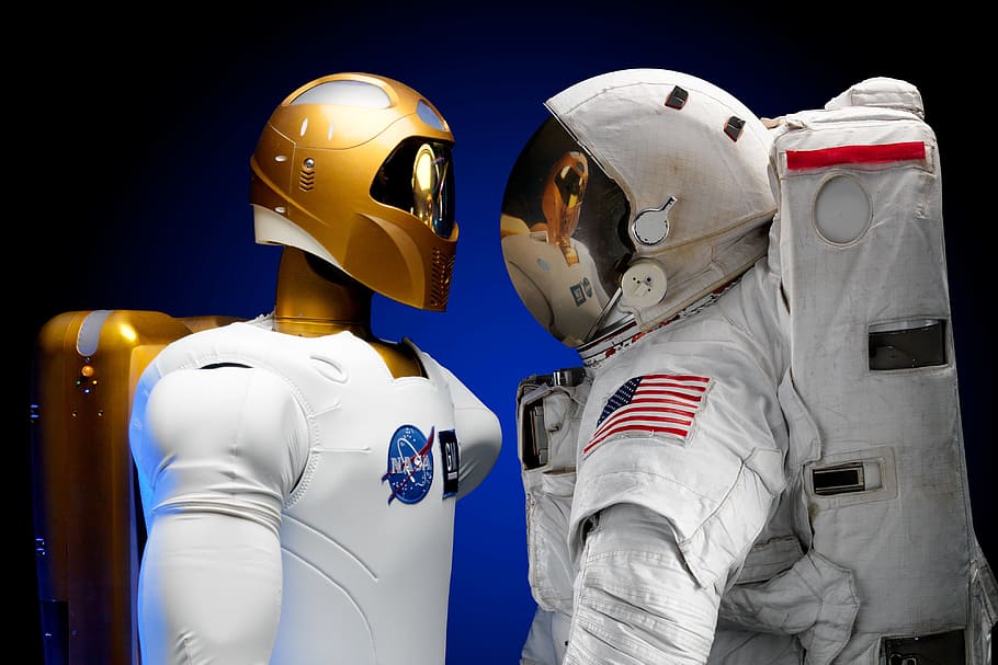 two, people, wearing, white, gold helmets, robonaut, machines, dexterous, humanoid, astronaut