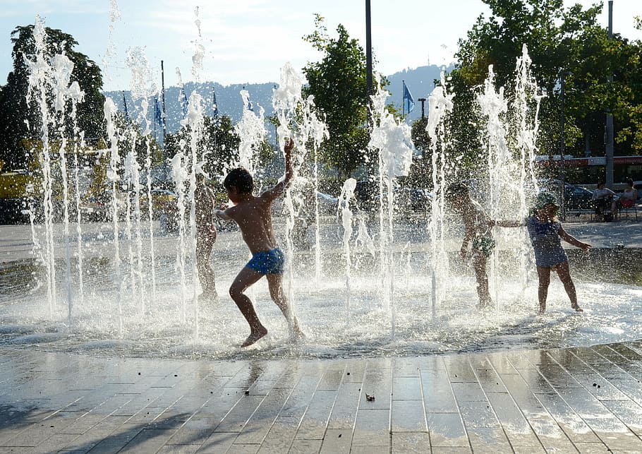 boy, wearing, blue, brief, children playing, water fountain, zurich, lake zurich, bellevue, motion