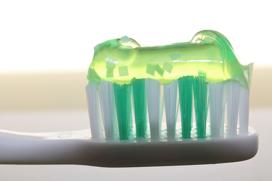 toothpaste on toothbrush, toothbrush, toothpaste, dentistry, oral, luminous green, bristles, dentist, teeth, brush