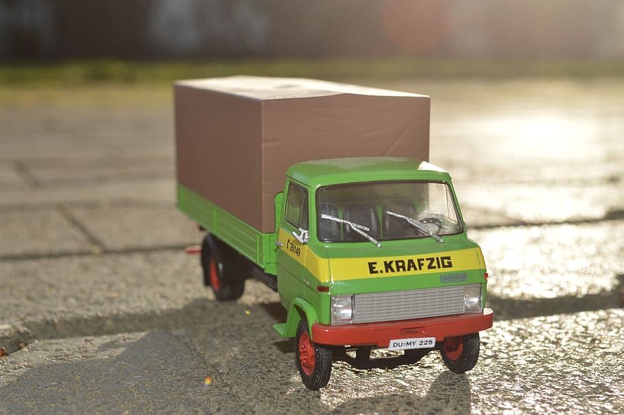 green, die-cast metal delivery truck, toy car, toys, truck, auto, car, automotive, vehicle, transportation