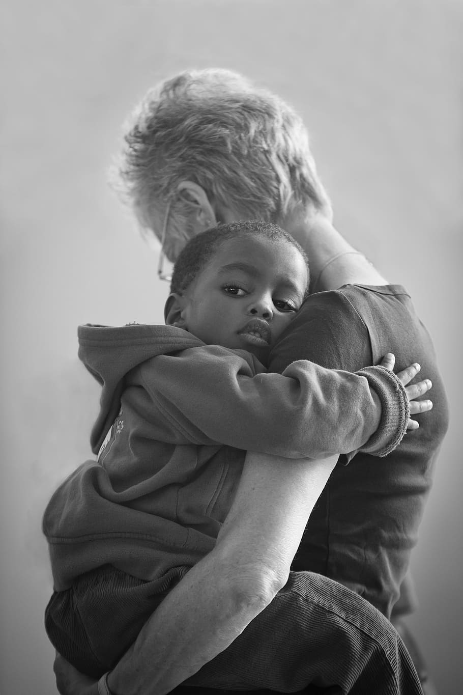 boy hugging woman, love, africa, orphan, child, humanitarian, cuddle, family, mother, tenderness