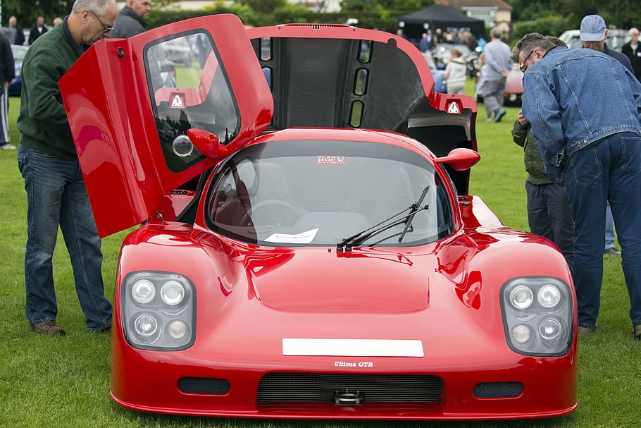men, looking, red, sports coupe, parked, green, grass, daytime, ultima gtr, motor car