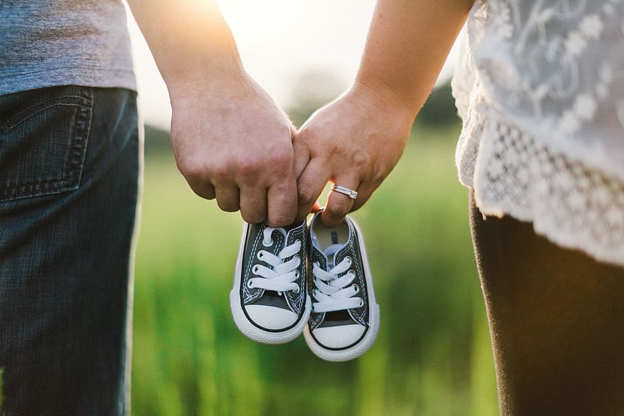 two, person, holding, baby shoes, holding hands, shoes, little, baby, couple, family