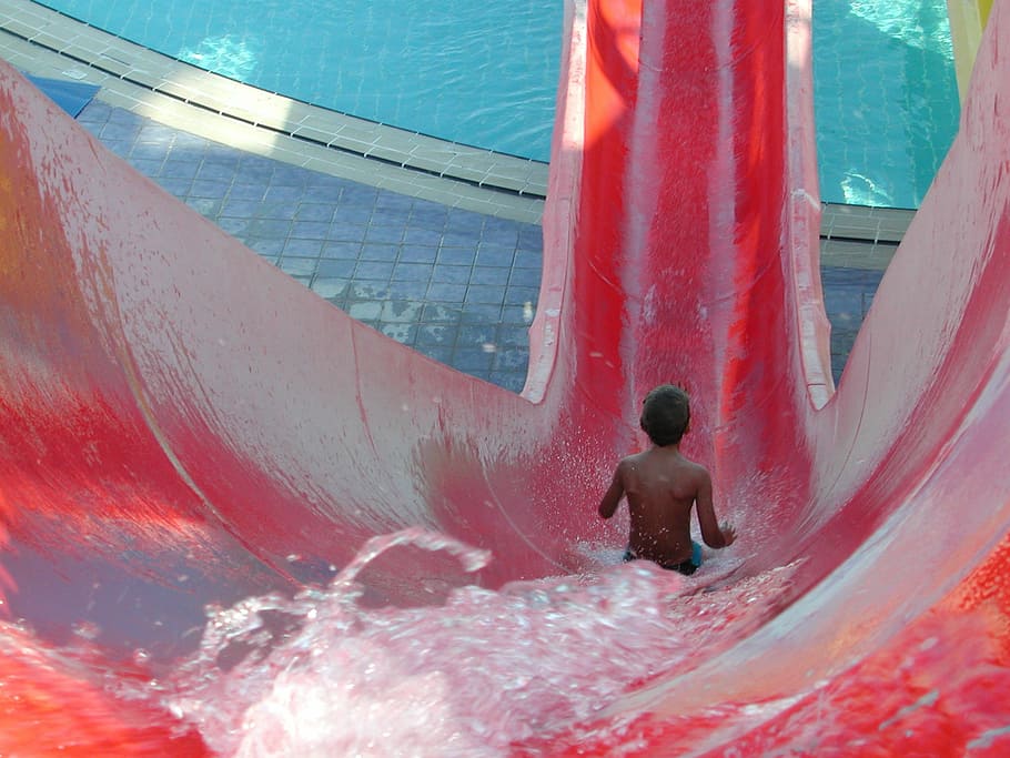 boy, pool slide, slide, slip, child slips, water park, swimming pool, shirtless, water, rear view
