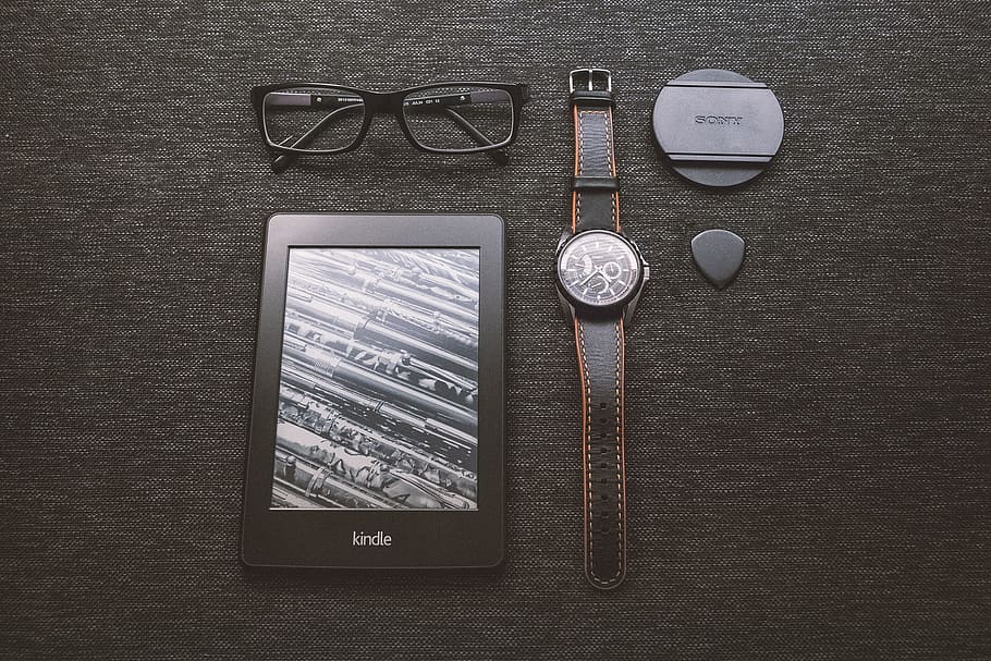 kindle, e-reader, technology, objects, watch, eyeglasses, accessories, table, communication, directly above