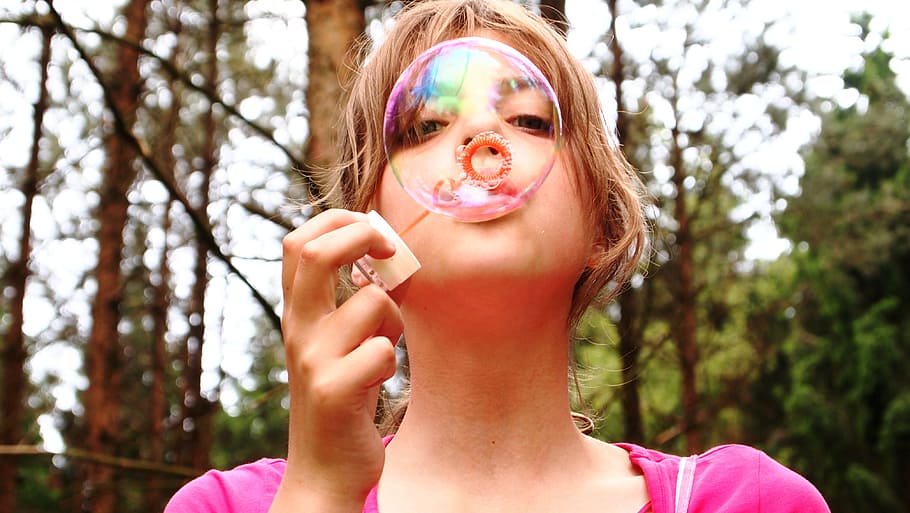 girl, wearing, pink, top, blowing, balloon, blow bubbles, forest, happy, face