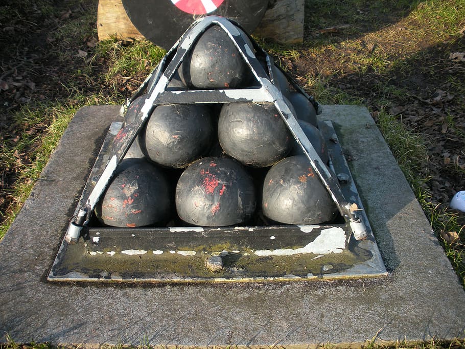 cannon balls, old, bolted, iron pyramid, iron, cement, black, gray, day, nature