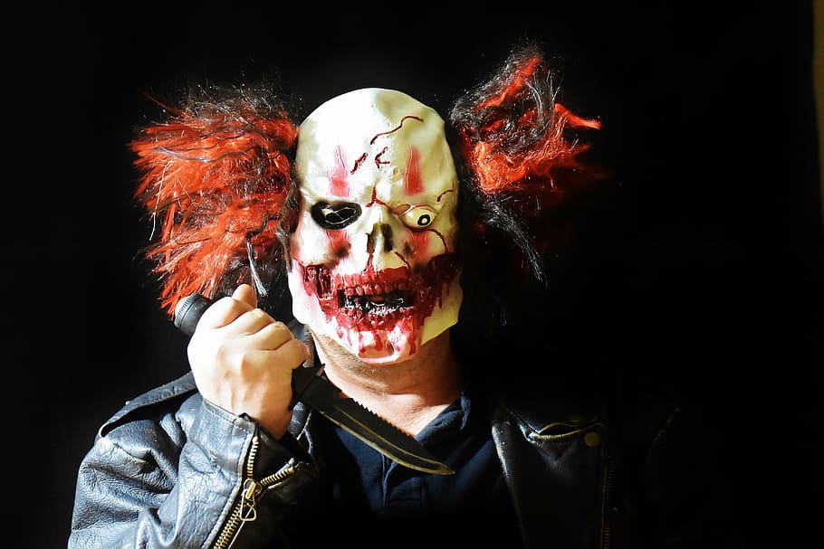 man, wearing, white, red, joker portrait photo, horror clown, mass murderer, knife, mask, clown